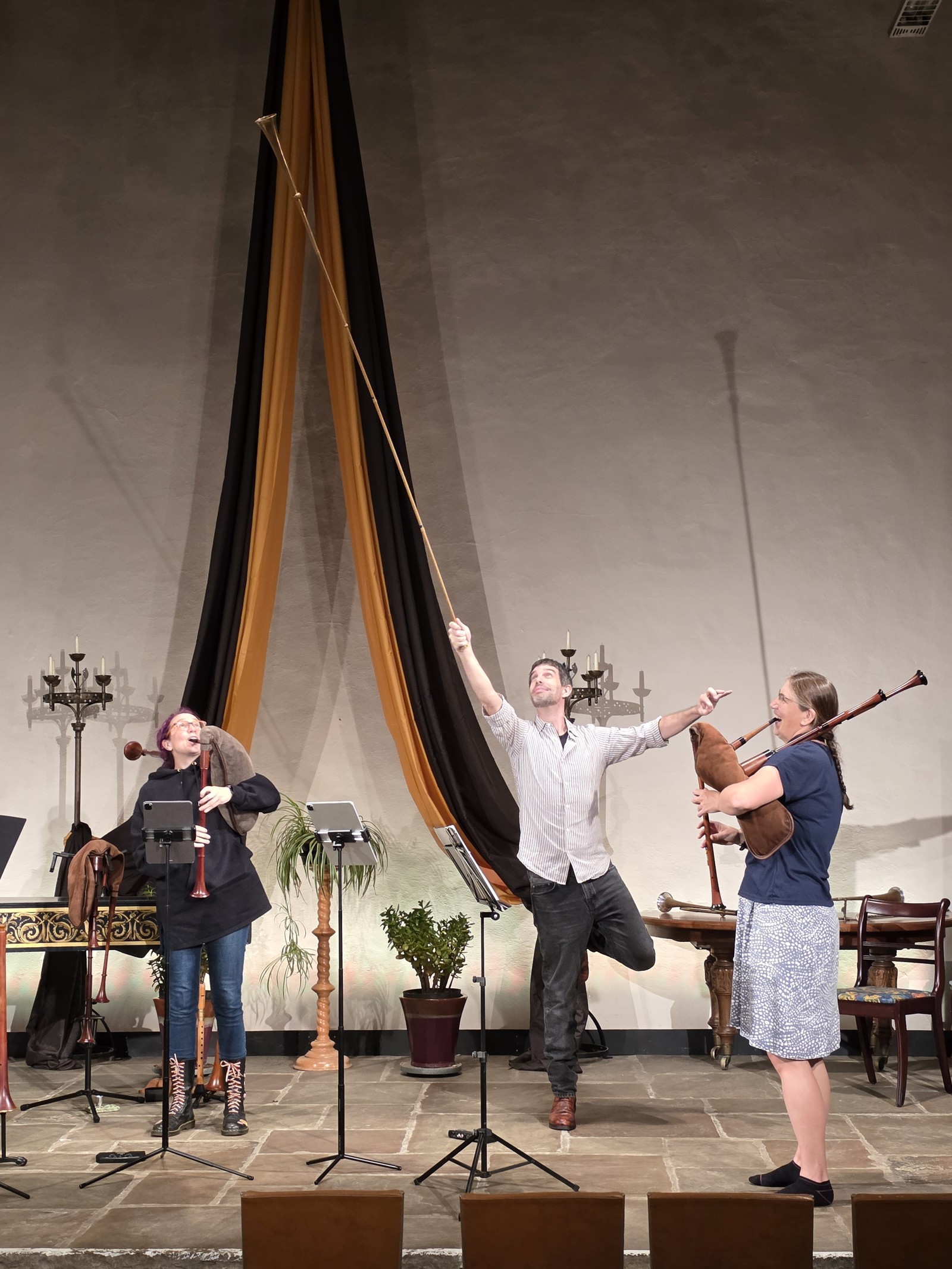 Daniel Serafini playing the buisine, with Emily Baines and Lizzie Gutteridge